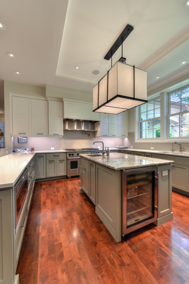 Custom kitchen renovation with large island and coordinated interior finishes