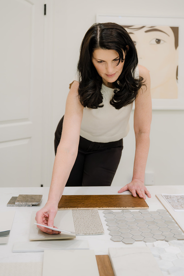Deborah Miller reviewing custom material and finish selections for a luxury home project