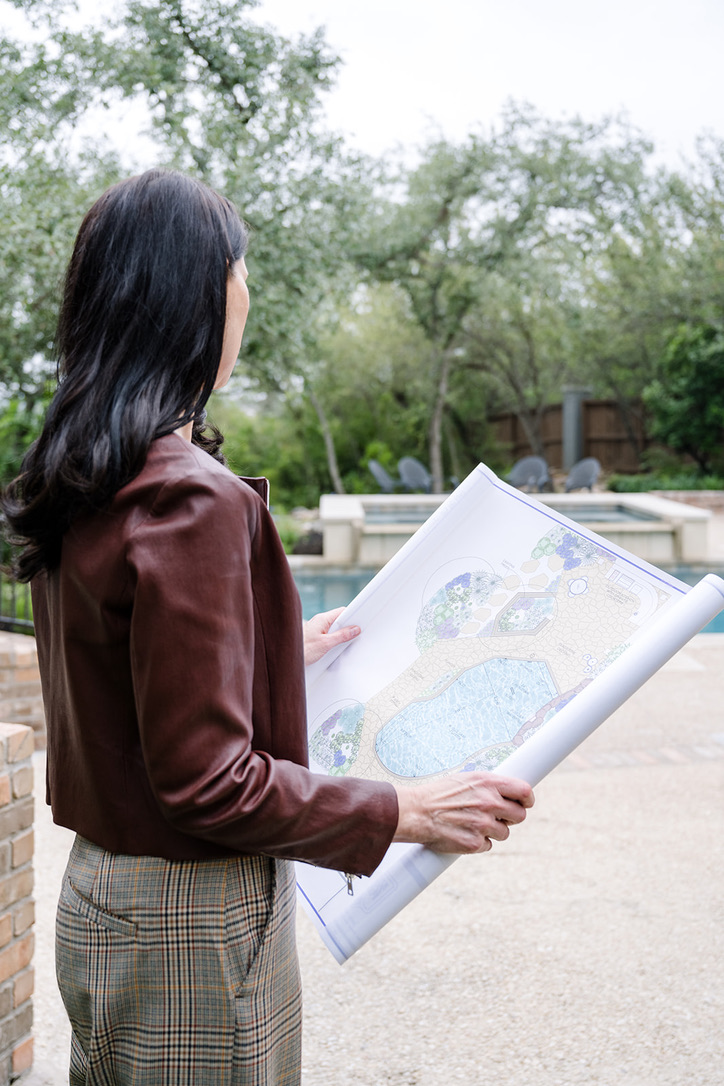 Residential owner's representative reviewing landscape plans during a custom home project